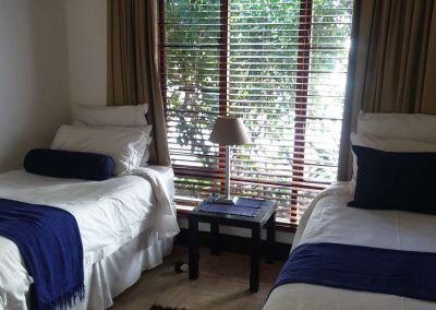 The second bedroom in the Sandton Gateway self-catering apartment in Craighall Park, Johannesburg.